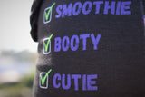 Woman wearing cute black vegan jogger sweatpants with graphic