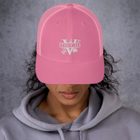 Woman wearing a pink Ethi-Cali vegan trucker hat